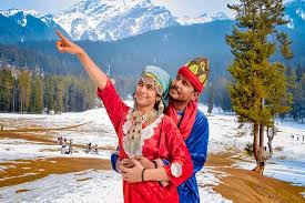 Couple enjoying in traditional Kashmiri attire during a romantic Kashmir holiday package | Panda Tours and Travels
