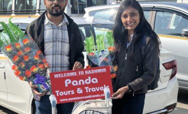 A beautiful couple receiving a warm welcome by PAnda Tours and Travels on their offberat kashmir tour package