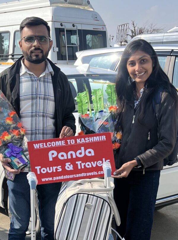 A beautiful couple receiving a warm welcome by PAnda Tours and Travels on their offberat kashmir tour package