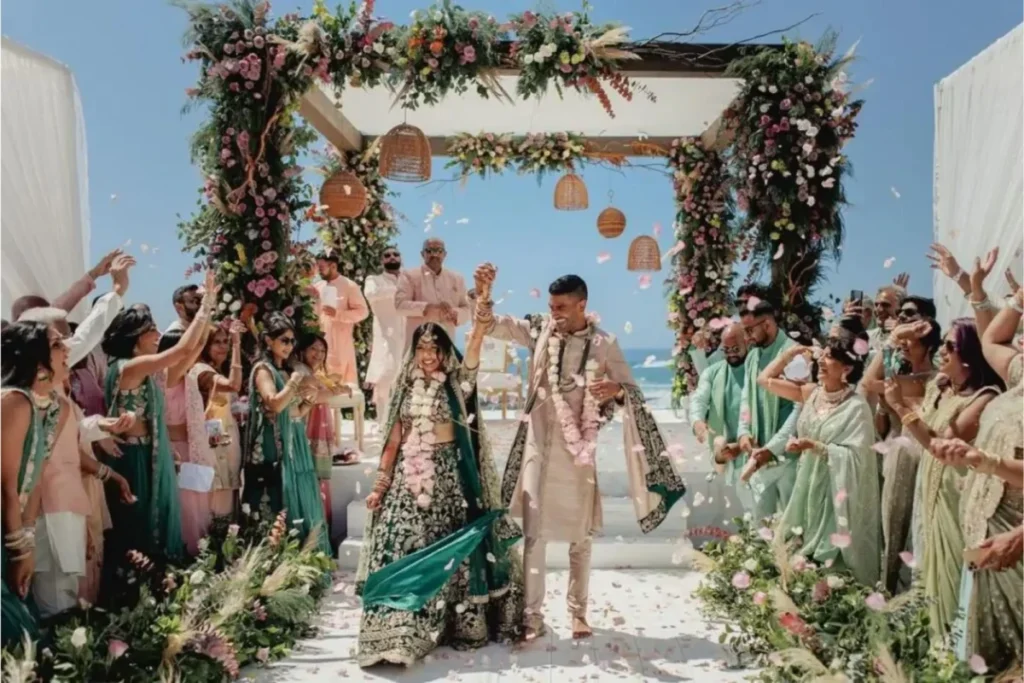 Guests showering flowers over the couple during a joyful destination wedding in Kashmir | Panda Tours and Travels