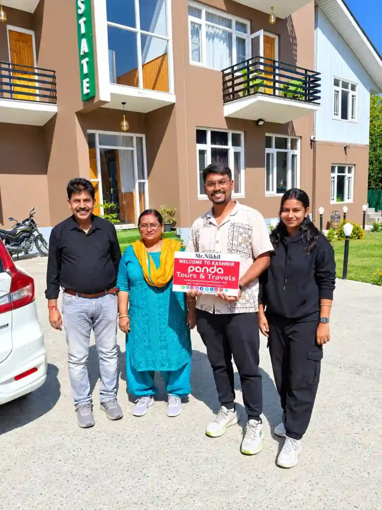 Family from Pune welcomed with flowers at Srinagar Hotel by Panda Tours and Travels