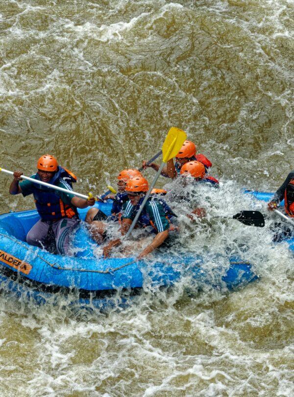 Rafting in Kashmir on a fast-flowing river surrounded by scenic mountains | Panda Tours and Travels