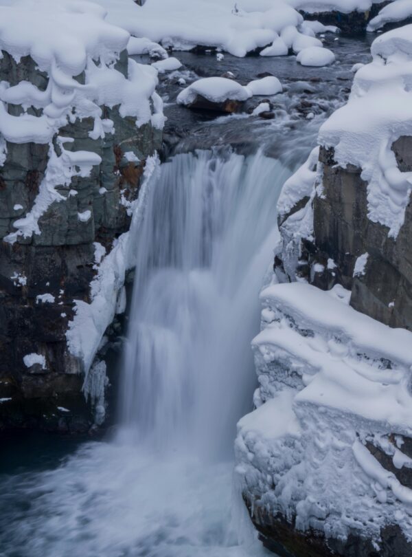 Aharbal Waterfall tour packages showcasing the majestic cascade surrounded by lush greenery in Kashmir | Panda Tours and Travels