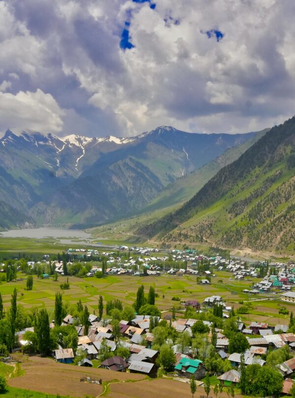 Gurez Valley landscape with snow-capped mountains, lush meadows, and the flowing Kishanganga River in Kashmir | Panda Tours and Travels