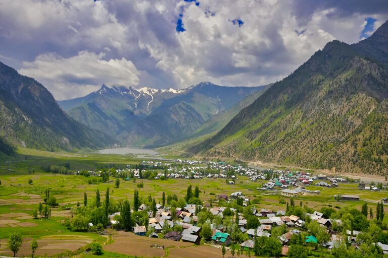 Gurez Valley landscape with snow-capped mountains, lush meadows, and the flowing Kishanganga River in Kashmir | Panda Tours and Travels