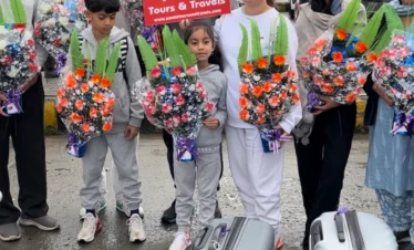 Tourists family welcomed by panda tours and travels on arrival at srinagar international airport for their kashmir tour.