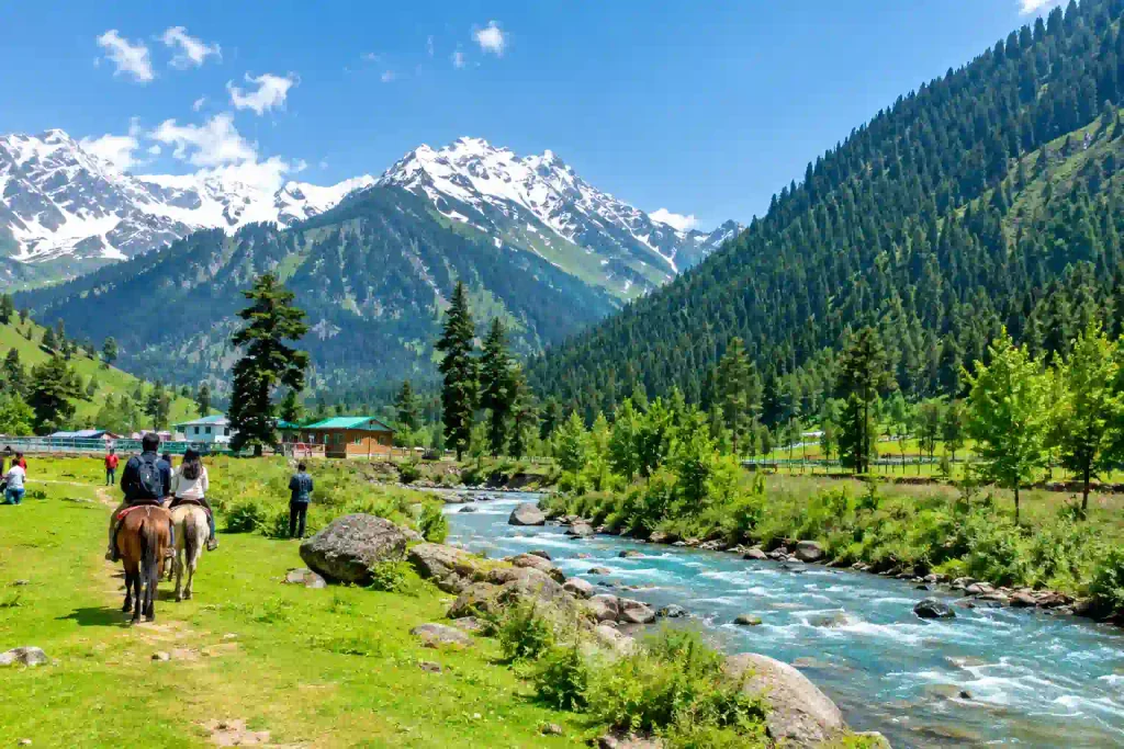 Kashmir in June 2027: Weather, Temperature And Places to Visit 3 Pahalgam, Kashmir in June — scenic mountain valley with river, green meadows, and snow-capped peaks
