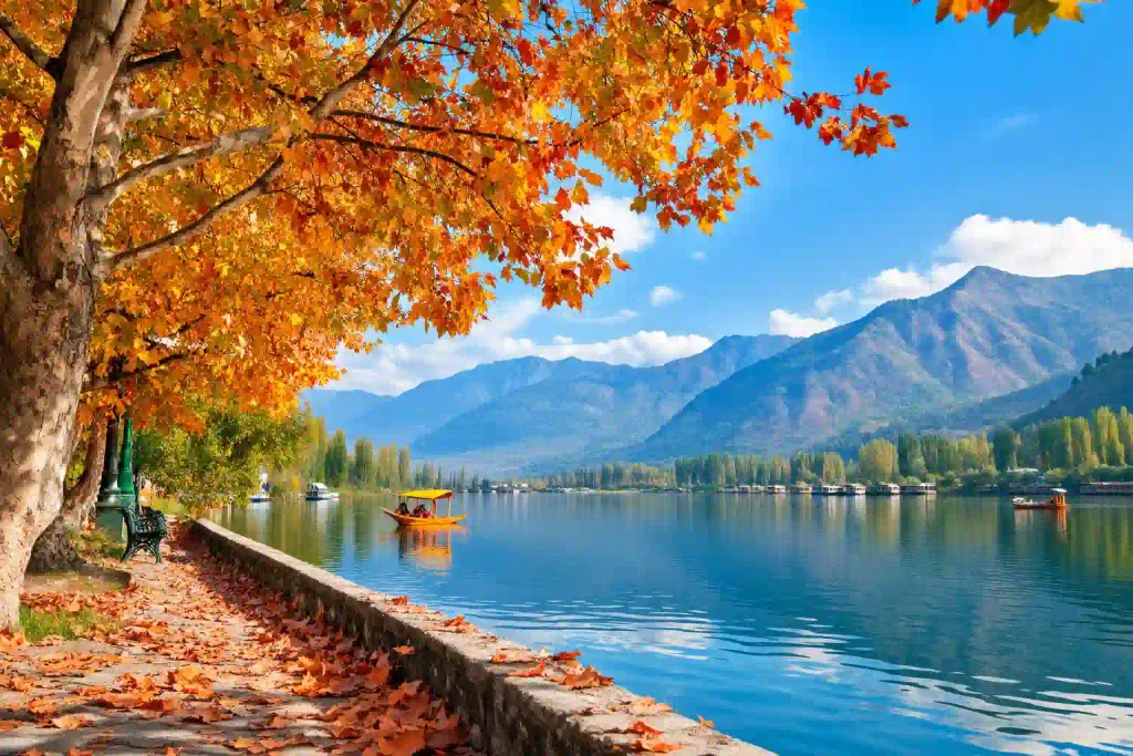 Kashmir in August with orange chenar leaves, a beautiful lake, mountains and clear blue sky