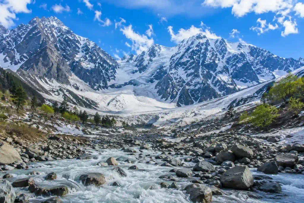 Thajiwas Glacier in Sonamarg with snow-covered mountains and a glacier-fed stream in Kashmir