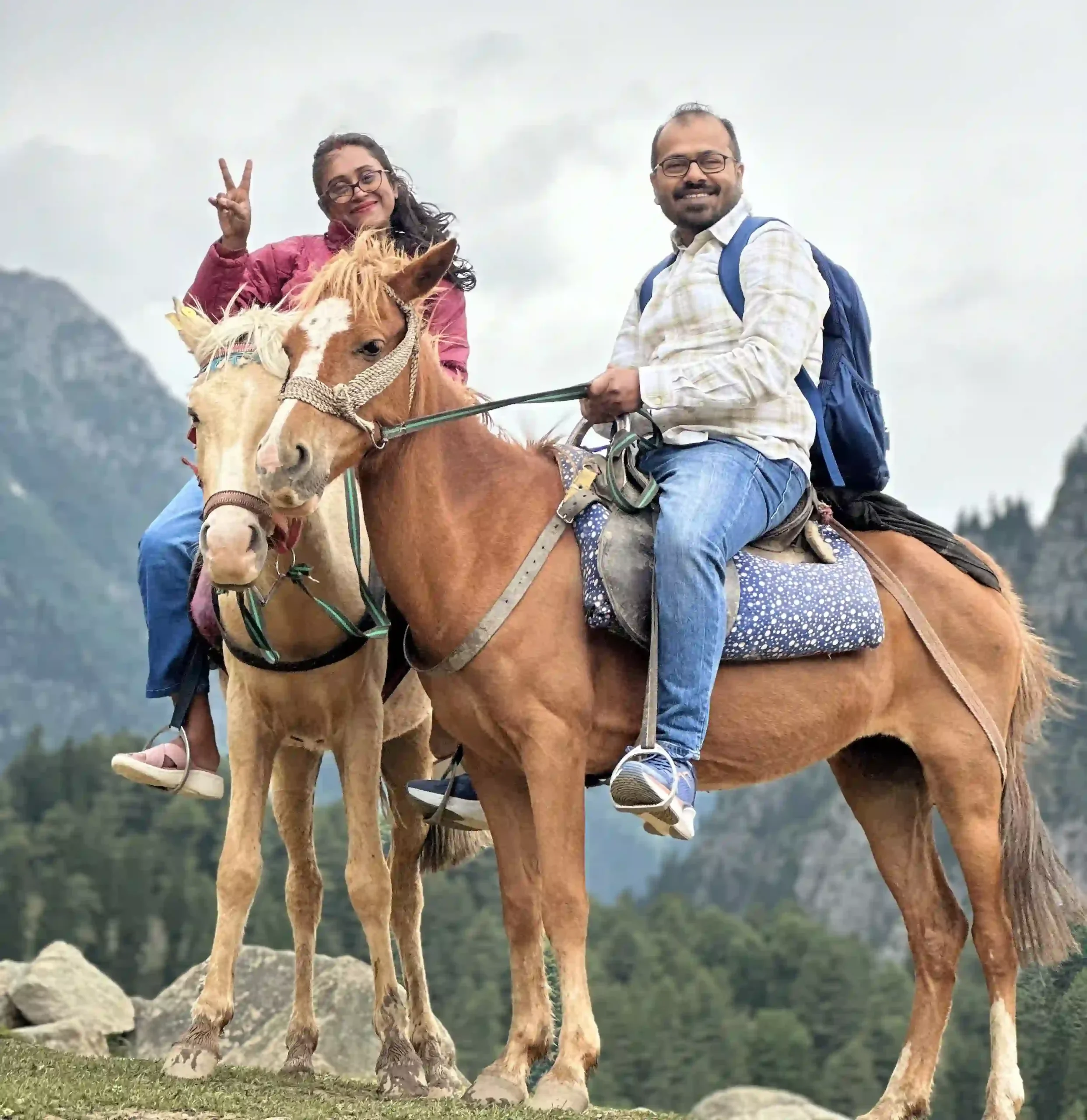 Tourists enjoying a horse ride in Sonamarg, Kashmir with scenic mountain views