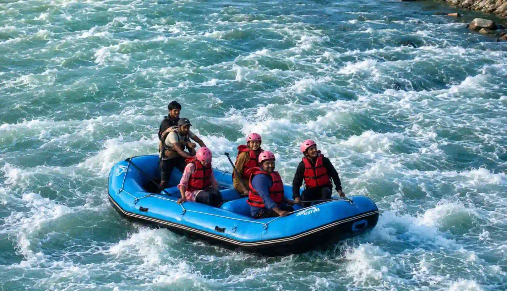 River Rafting in Kashmir: Prices, Routes, Best Time And Booking Guide 4 Tourists enjoying an exciting river rafting adventure in the fast-flowing river at Pahalgam, Kashmir
